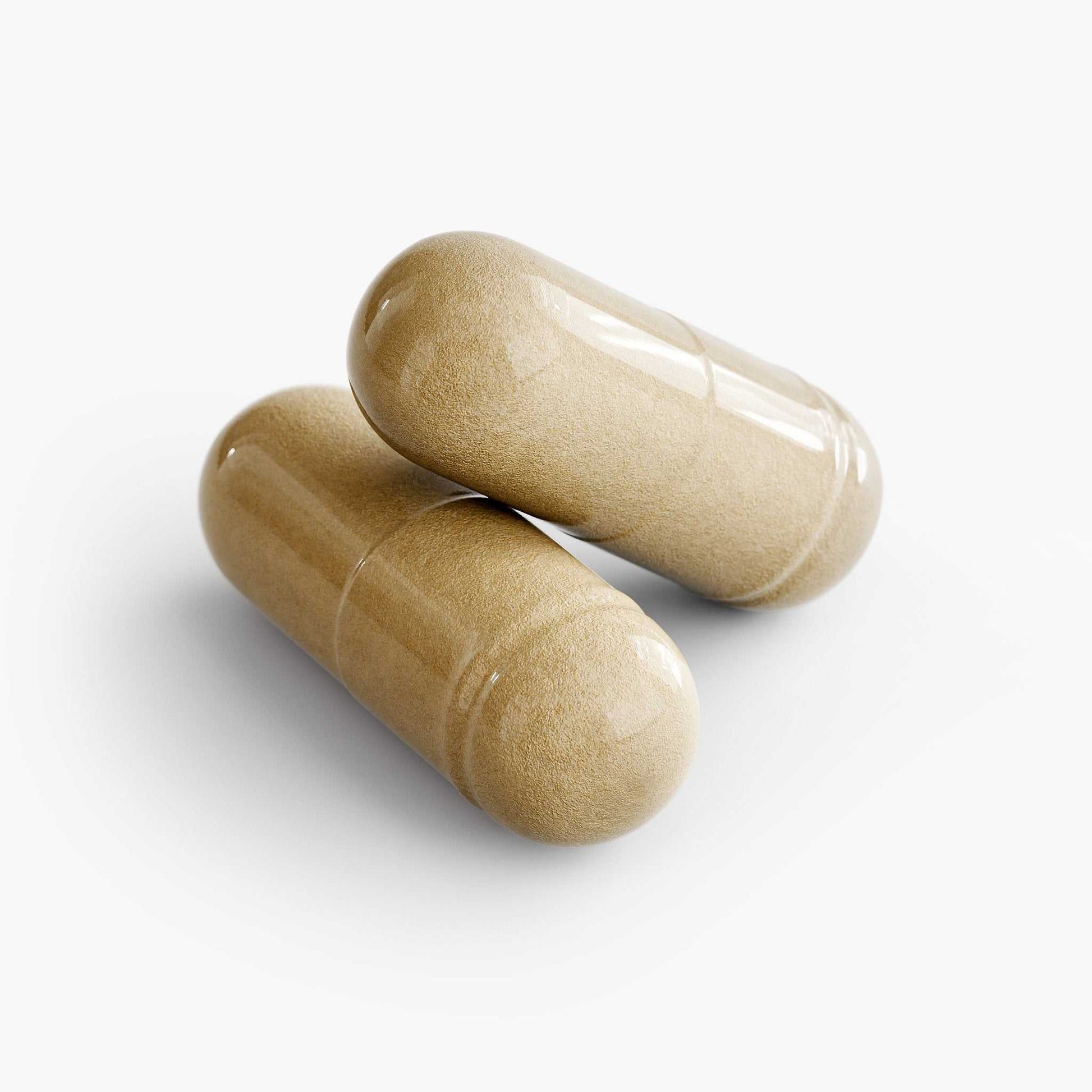 Two beige Hair, Skin, and Nails supplement capsules isolated on white background